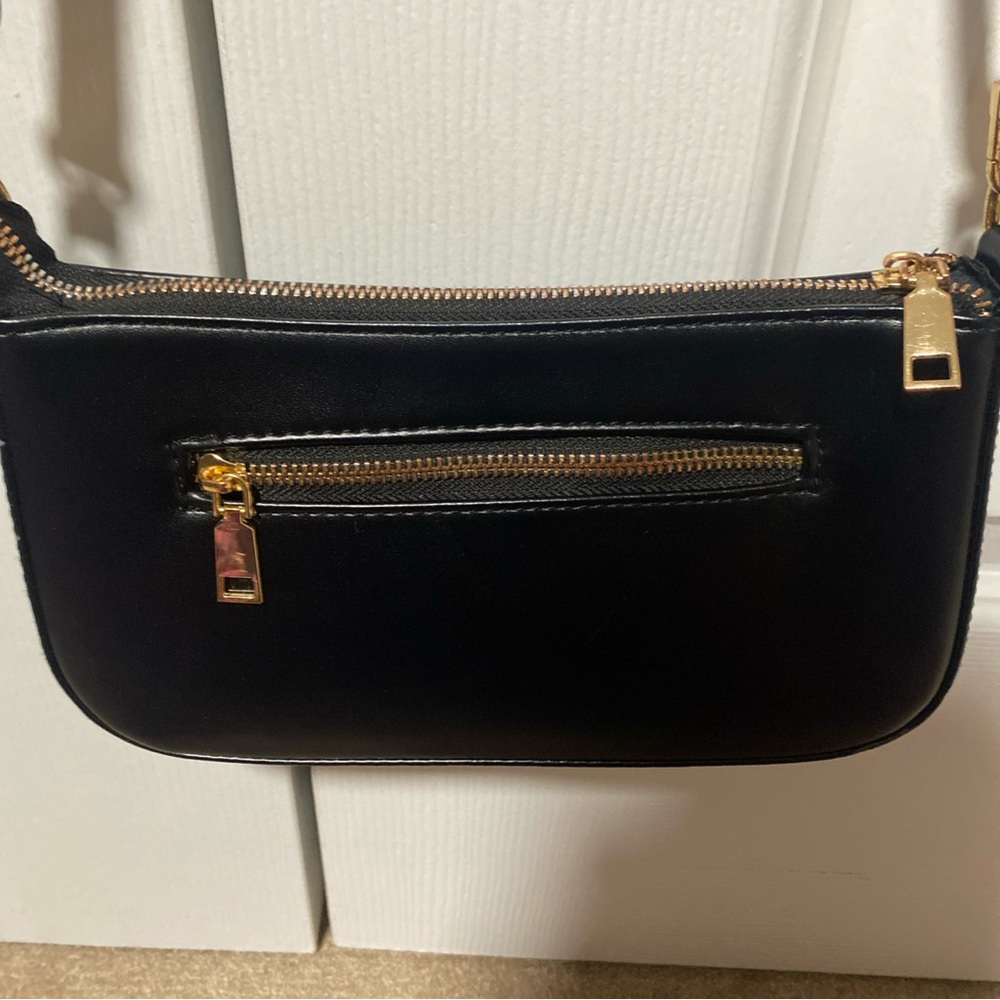 Black and Gold Crossbody Bag with Sleek Design